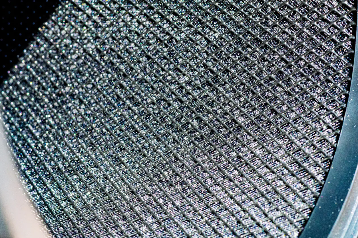  Close-up macro of the inner side of a clean air purifier filter. Detailed texture of the mesh surface, symbolizing fresh air