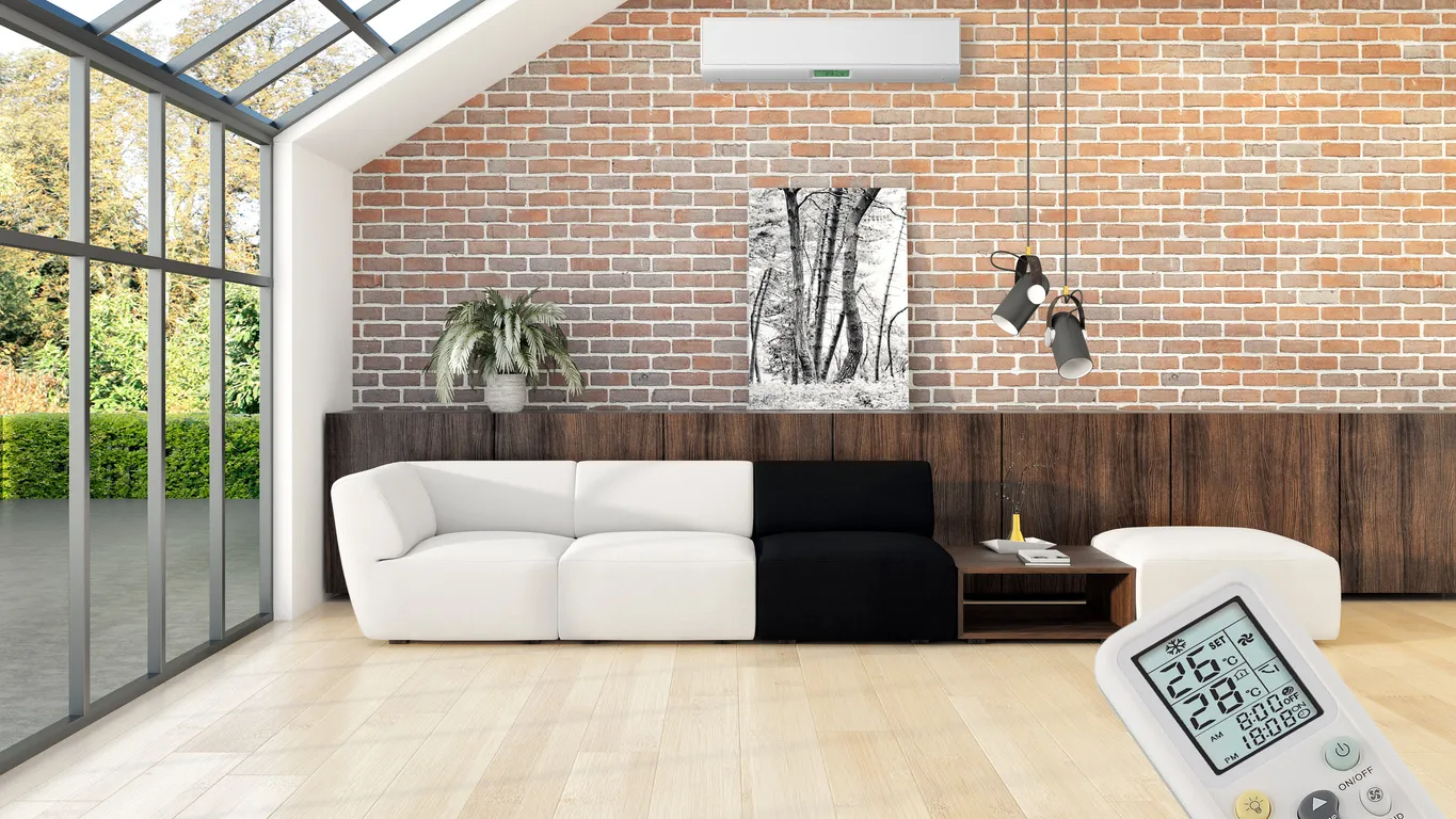 Habitación moderna con interiores luminosos, aire acondicionado y control remoto.